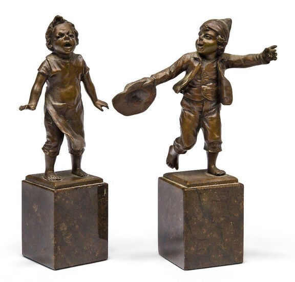 After Paul Ludwig Kowalczewski, German, 1865-1910, a pair of bronze figures of boys, early 20th century, each bare footed, the bases with cast signature Kowalczewski, on marble plinths, 15cm high (2)