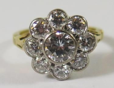 An 18ct Yellow Gold and Diamond Cluster Ring, the central ro...