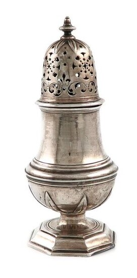 An 18th century continental silver caster, marked with a crowned B and another unidentified mark, possibly German, baluster form, with stiff leaf cut-card decoration, pull-off pierced cover with a knop finial, on a raised octagonal foot, height 15.5cm...