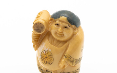 An Antique Japanese Carved Ivory Netsuke of a Man with Hammer