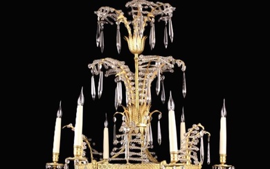 An Attractive French Empire Style Gilt Metal & Cut Glass Chandelier adorned with a waterfall of face