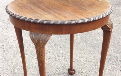 An Edwardian mahogany occasional table, the circular gadrooned top above...