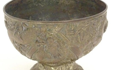 An Oriental cast pedestal bowl with relief decoration
