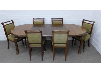 An oak extending dining table and six chairs, 216 x 72 x 107...