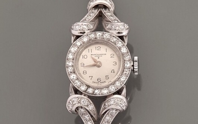 BAUME ET MERCIER, Bracelet montre en or gris, 750 MM, lunette ronde ourlée de diamants...