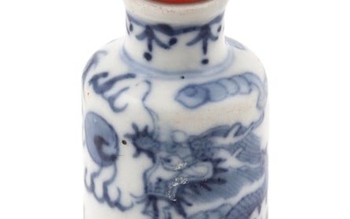 CHINESE BLUE AND WHITE PORCELAIN SNUFF BOTTLE Late 19th Century Height 3". Red stopper.