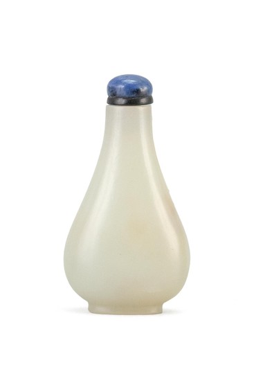 CHINESE WHITE JADE SNUFF BOTTLE In pear shape. Height 2.25". Lapis lazuli stopper.