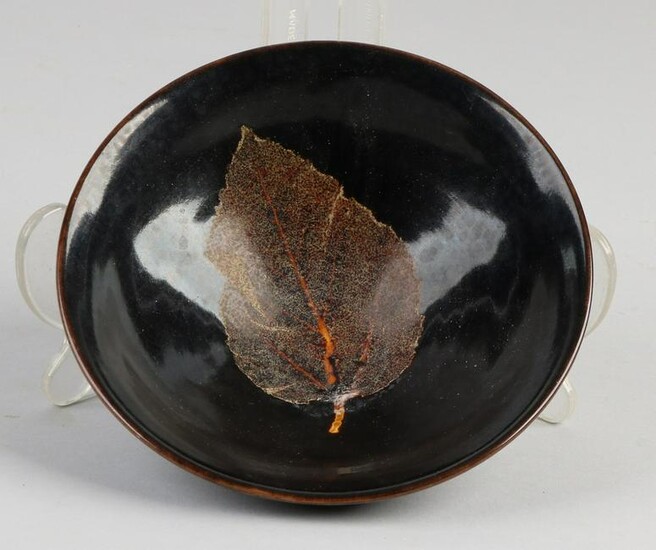 Chinese porcelain bowl with black glaze and leaf motif