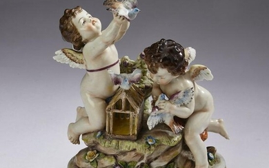 Continental porcelain putti and birdcage, 19th c.