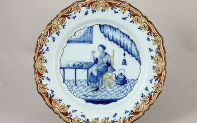 DELFT, 18th. Earthenware plate with blue monochrome decoration...