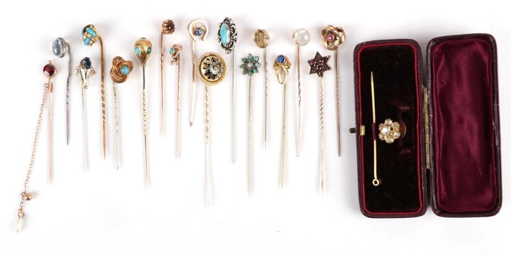 Eighteen Stick Pins; including a garnet and houndstooth pearl example,...