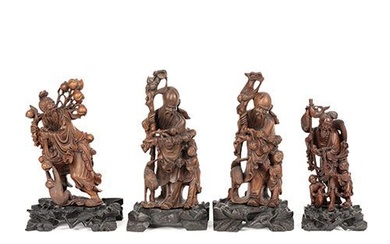 Ensemble de quatre figurines en bois sculpté de haute qualité, Chine. Sur des bases en...