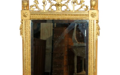 French Louis XVI gold leaf mirror with elaborate pierced crest