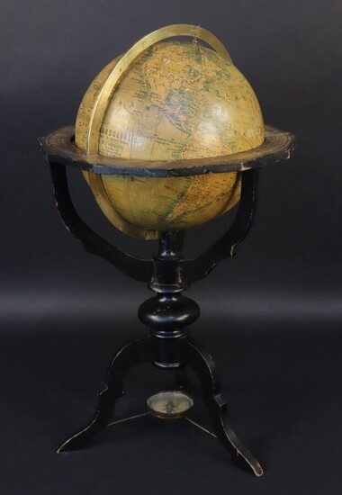 Globe. According to H.A Willionk in Arnhem, factory of J. Felki in Prague. Engraved brass meridian circle (missing the rotation knob on the axis). Equatorial table resting on a tripod base in blackened wood attached to a compass. Mention : "...