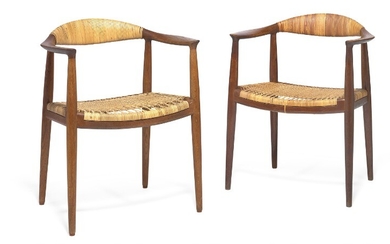 Hans J. Wegner: “The Chair”. A pair of dark patinated oak armchairs. Seat and back with woven cane. Model JH 501. (2)