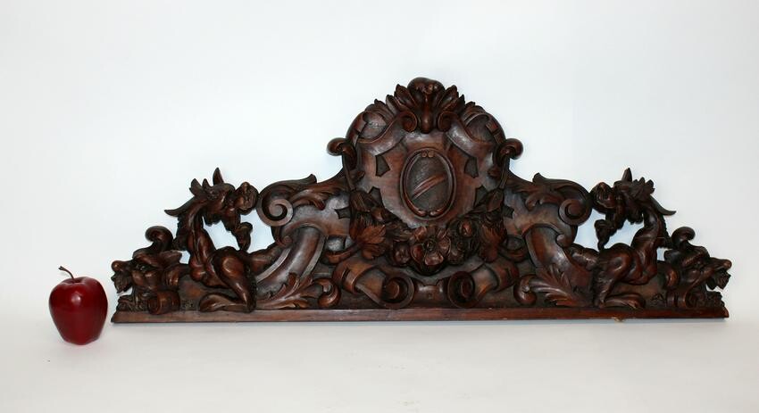Italian carved walnut crest with crest and chimera