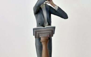 LLADRO PORCELAIN FIGURE OF A CONDUCTOR