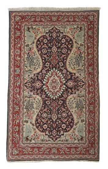 Medallion carpet with landscape motifs of Persia, c. 1970, wool on cotton, pointed oval medallion on a black field with a floral design, pronounced gusset fields with landscape motifs, red-ground border with birds in a palmette vine, LxW: 212/129 cm...