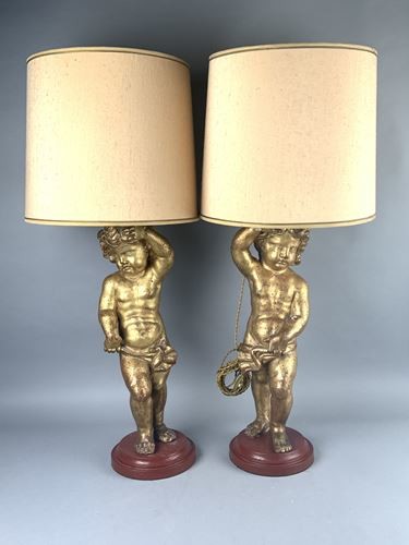 Pair of putti in carved and gilded wood...