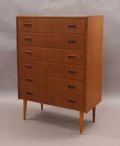 Please Note - the legs are not associated and detached A Danish teak chest of drawers, circa 1960, with six drawers on tapering on non associated cylindrical supports, 106cm high, 76cm wide, 38cm deep