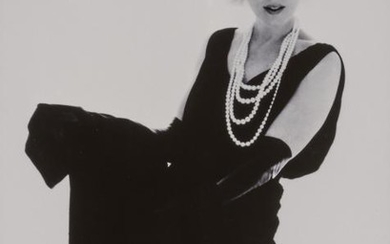 STERN, BERT (1929-2013) Marilyn Monroe in black Dior dress with pearls