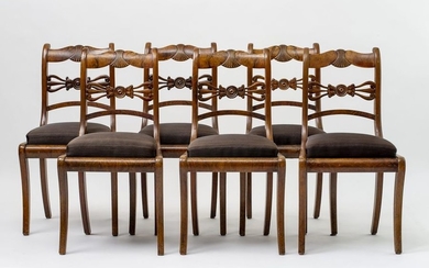 Six Biedermeier chairs. On sabre legs, trapezoidal, upholstered...