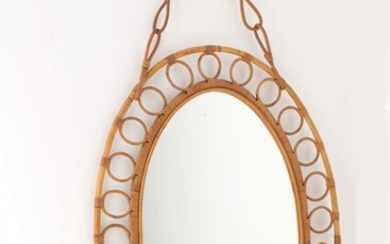 Specchio ovale con cornice in midollino. Manifattura italiana. Anni...