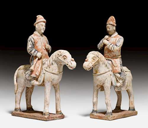 TWO PAINTED POTTERY FIGURES OF MUSICIANS ON HORSES.