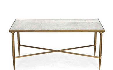 Table basse en bronze doré et laiton, avec plateau en verre azur. . Dimensions :...