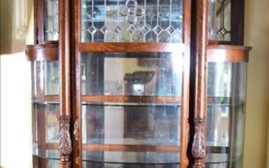 Tall quarter sawn oak china cabinet with bow front