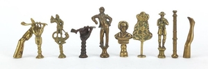 Ten antique pipe tampers including Bonnie Prince Charlie, fi...