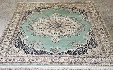 Turkish machine made wool blend carpet with green field & cream border (356 x 245cm)