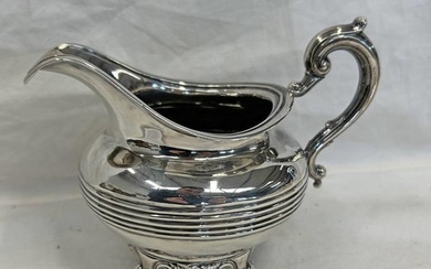 VICTORIAN SILVER CREAM JUG WITH RIBBED DECORATION ON 4 SHAPE...