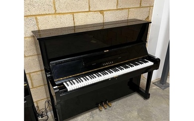Yamaha (c1975) A Model U1 upright piano in a traditional bri...