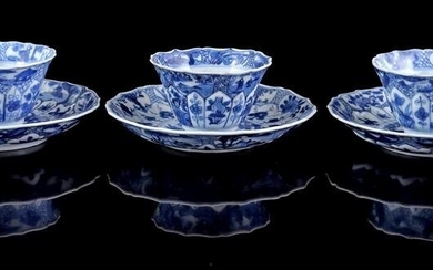 3 porcelain cups and saucers with a contoured rim and a