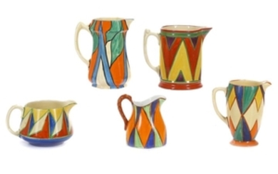 CLARICE CLIFF BIZARRE COLLECTION OF FIVE JUGS, in...