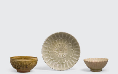 A group of three small glazed stoneware containers