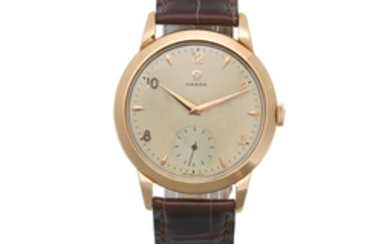 Omega. An 18K gold manual wind wristwatch