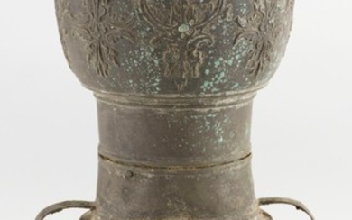 CHINESE BRONZE ARCHAIC-STYLE WAISTED VASE Top and base with raised foliate decoration. Base with loop handles extending to waist. He...