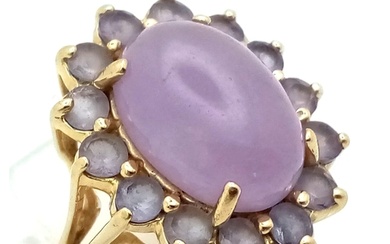 A 14K Yellow Gold Lavender Jade Ring. Large oval jade caboch...