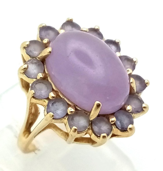A 14K Yellow Gold Lavender Jade Ring. Large oval...