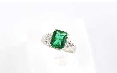 A 14ct white gold green stone (not emerald) & diamond ring, ...