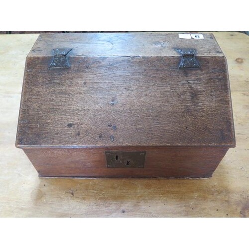 A 19th century oak clerks box with a sloping front and three...