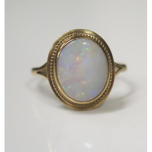 A 9ct Yellow Gold and White Opal Dress Ring, 7x9mm stone, si...