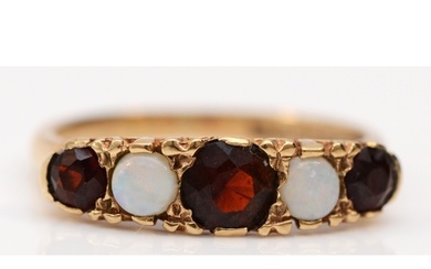 A 9ct gold opal and garnet five stone ring, carved setting, ...