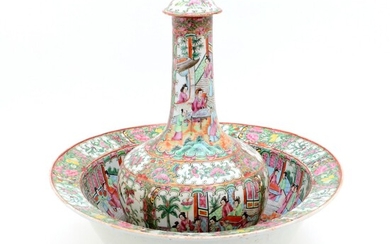 A BASIN WITH BOTTLE