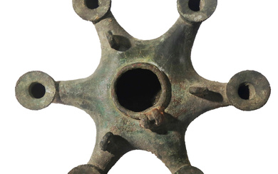 A BYZANTINE BRONZE OIL LAMP WITH 6 NOZZLES.