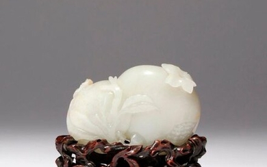 A CHINESE PALE CELADON JADE CARVING OF POMEGRANATES QIANLONG 1736-95...