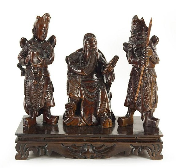 A Chinese Carved Wood Figural Group of Three Immortals.