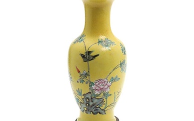 A Chinese baluster porcelain vase, decorated in colours with a bird and...